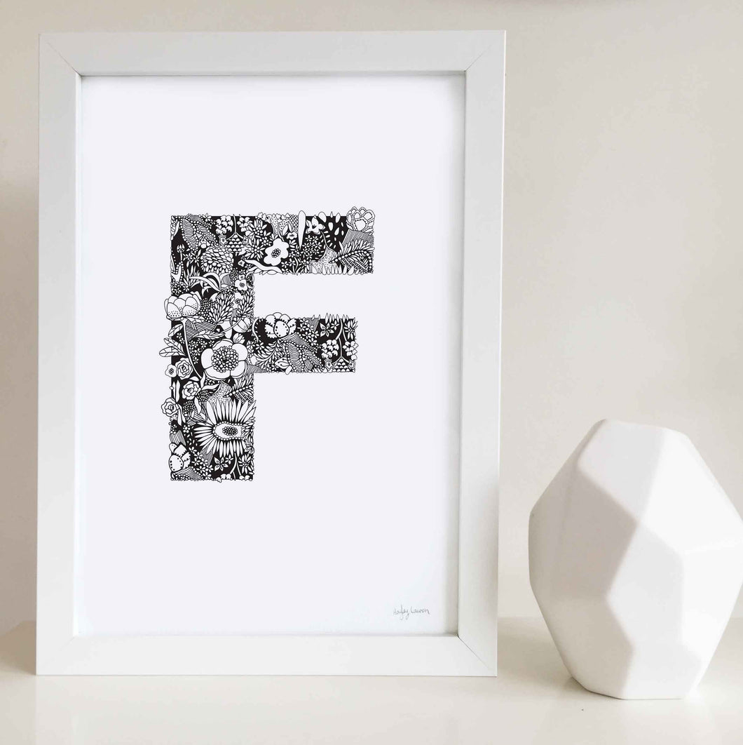 The floral letter 'F' artwork was illustrated by Hayley Lauren in Melbourne, Australia. It is the perfect artwork to personalise a nursery or kids bedroom. 