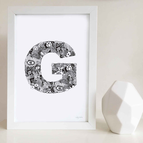 The floral letter 'G' artwork was illustrated by Hayley Lauren in Melbourne, Australia. It is the perfect artwork to personalise a nursery or kids bedroom. 