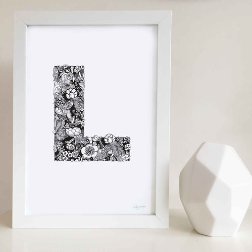 The floral letter 'L' artwork was illustrated by Hayley Lauren in Melbourne, Australia. It is the perfect artwork to personalise a nursery or kids bedroom. 