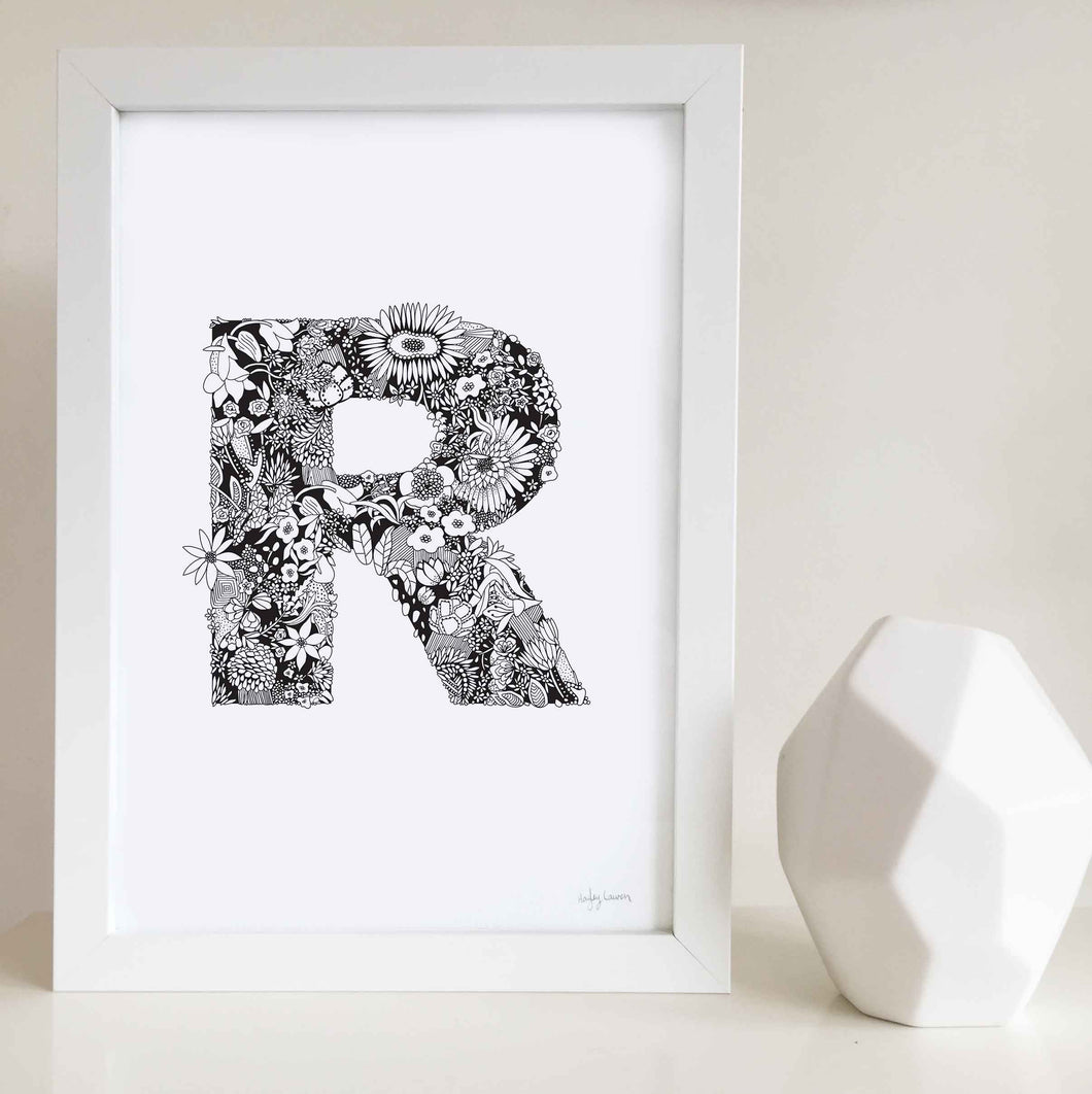 The floral letter 'R' artwork was illustrated by Hayley Lauren in Melbourne, Australia. It is the perfect artwork to personalise a nursery or kids bedroom. 