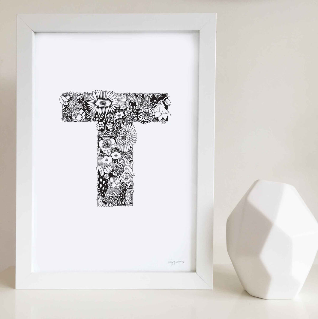 The floral letter 'T' artwork was illustrated by Hayley Lauren in Melbourne, Australia. It is the perfect artwork to personalise a nursery or kids bedroom. 